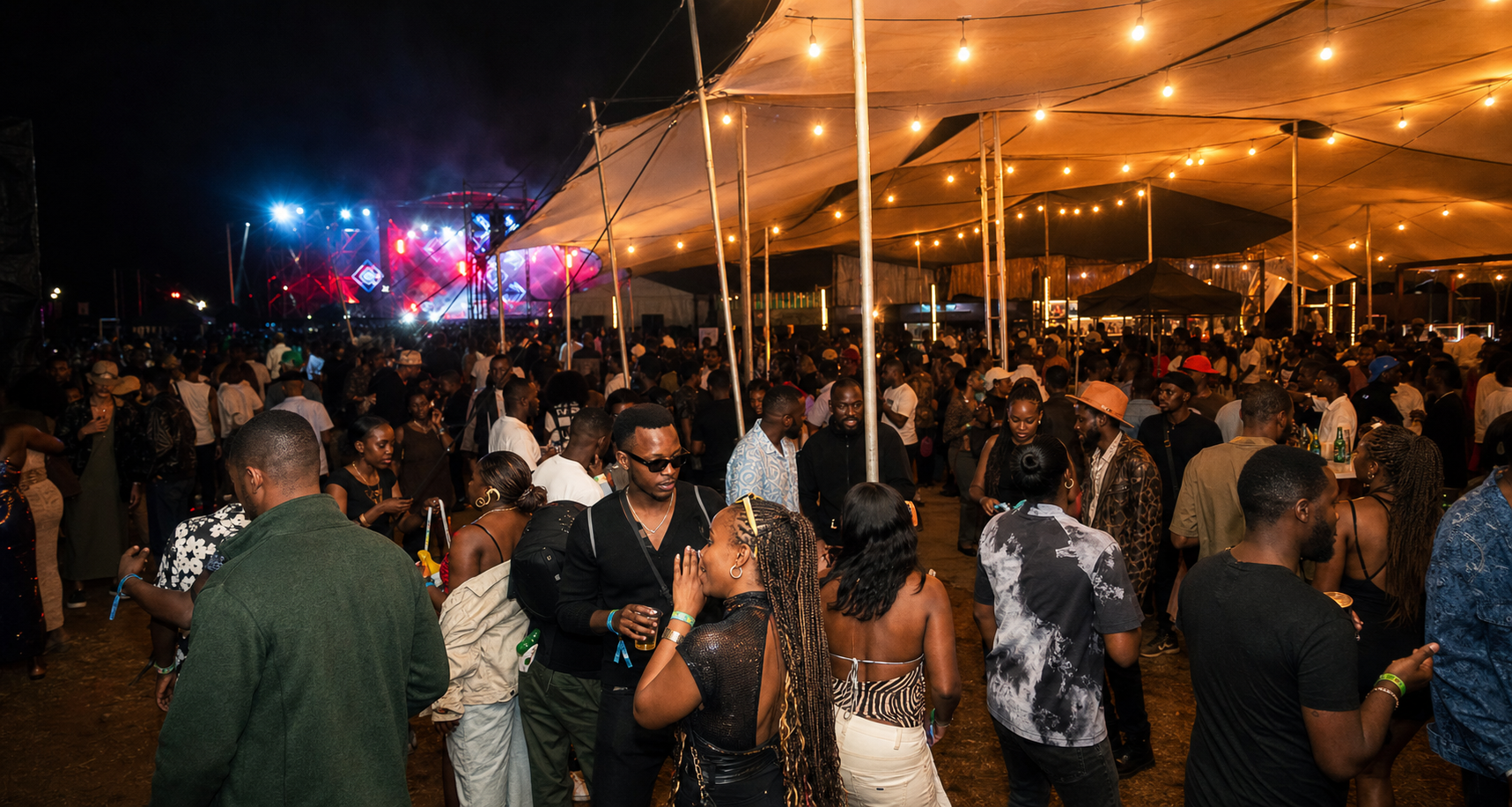 Festivalgoers under a tent at an ASILI-style night event
