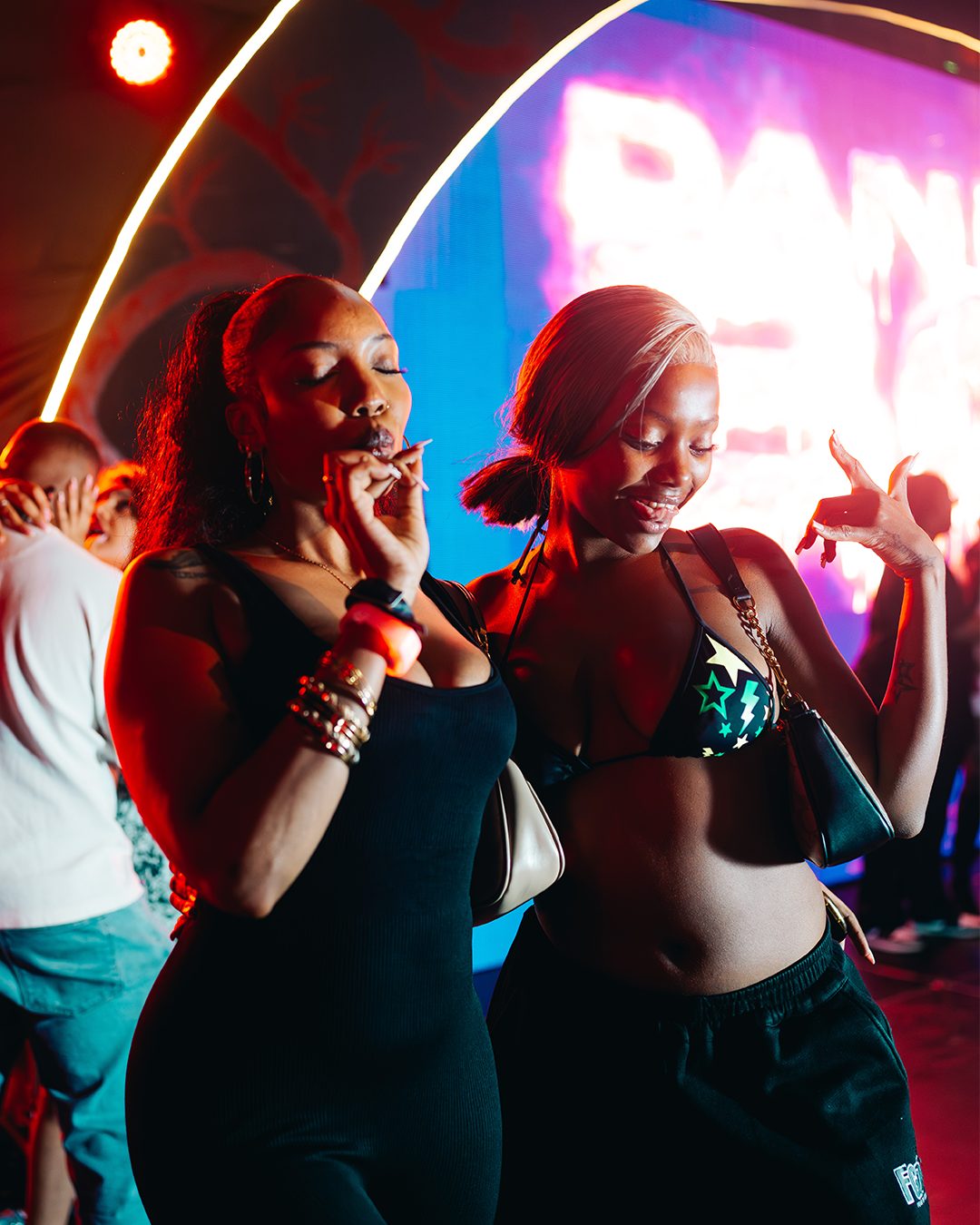 ASILI Experience guests singing and dancing near the stage